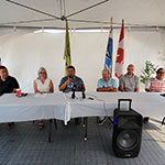 Chief Jeremy Fourhorns, Minister Hajdu, Chief Michael Starr, Tim Green, Nathan Friesen and Sheldon Poitras sitting at a table.